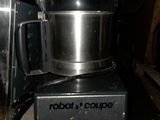 a blender sitting on top of a counter next to a toaster