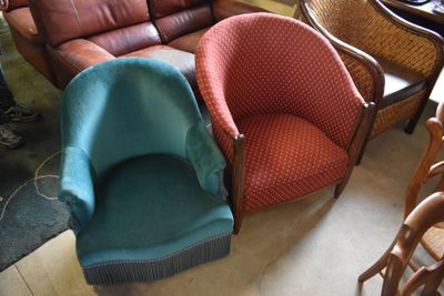 two chairs and a couch in a room together