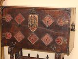 a wooden chest sitting on top of a wooden table