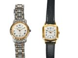 an image of a couple of watches sitting next to each other