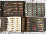 several different types of cigars are lined up on a bed
