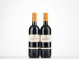 two bottles of red wine sitting on top of a table