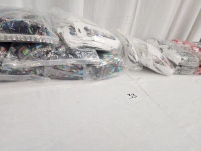 many bags of items that are sitting on a table