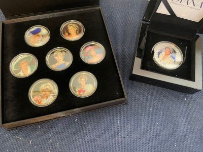 a box with six different commemorative coins in it