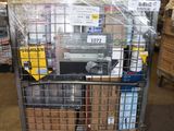 a shopping cart with many items in it in a warehouse