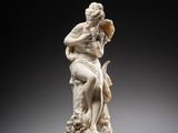 an image of a statue of a woman holding a flower