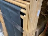 a wooden frame with a blue cloth hanging on it