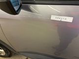 a car with a sticker on the side of it ' s door