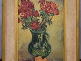 a painting of flowers in a green vase on a shelf