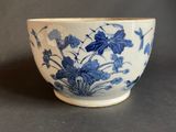 a blue and white bowl sitting on a table