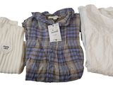 three men ' s sweaters and a women ' s sweater on a white background