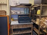 a room with a bunch of items on the shelves