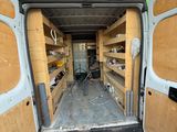 a van that is parked in a lot with the door open