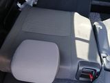 a seat in the back of a car with a remote control