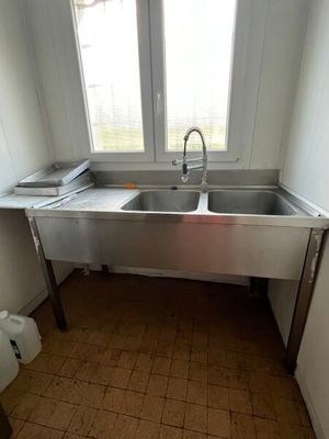 a kitchen with a sink and a window in it