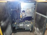 a machine that is sitting inside of a metal cabinet
