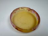 a small bowl of soup sitting on a table