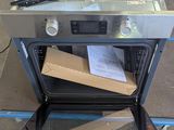 a box in the oven that is being opened
