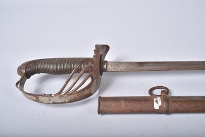 two old swords that are laying next to each other