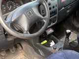 the interior of a car with a steering wheel, dashboard, and dash board