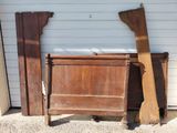two pieces of wood leaning against a garage wall