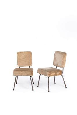 pair of mid - century chairs with upholstered backrests and metal legs