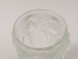 a clear glass cup with a pattern on it