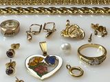 many different types of jewelry displayed on a table