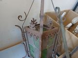 a small lantern hanging from the ceiling next to other items