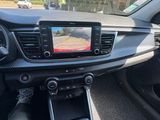 the interior of a car with a view of the driver ' s hand on the steering wheel