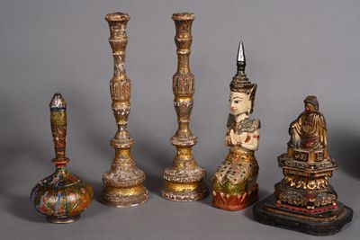 five different types of candlesticks on a table