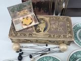 many plates and bowls on a table with a box on it