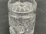 a glass jar with a lid on a table