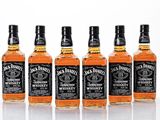 six bottles of jack daniels whiskey lined up in a row