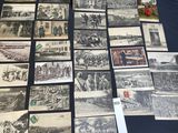 several old postcards of people and animals on a table