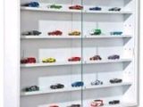 the display case holds a variety of toy cars in it