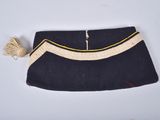 an image of a purse with a tassel on it