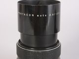 an image of a close up of a camera lens on a white surface