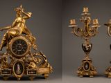 two different views of a clock with a statue on top of it