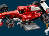a red toy racing car with a man on it