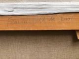 a piece of wood that has writing on it