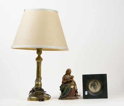a lamp that is next to a picture of a woman