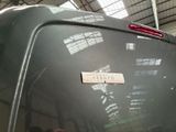 a sticker on the back of a car in a garage