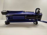 an image of a blue hydraulic jack on a white surface