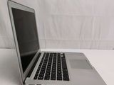 a laptop computer sitting on a table with a white background
