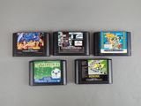 four nintendo game cartridges are lined up on a table