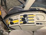 a close up of a car dashboard with a steering control