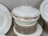 a lot of plates and bowls stacked on top of each other