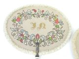 a picture of a pair of scissors on a doily