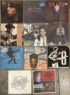 a lot of records and cds on the floor